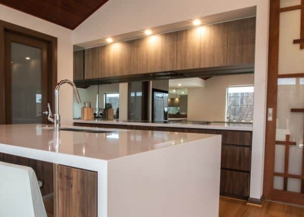 Mirrored glass splashback in a modern kitchen