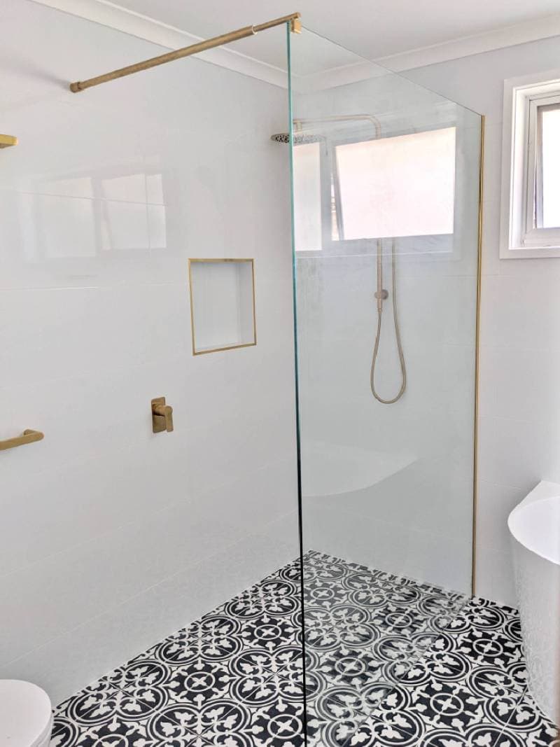 Walk in shower with brushes brass hardware