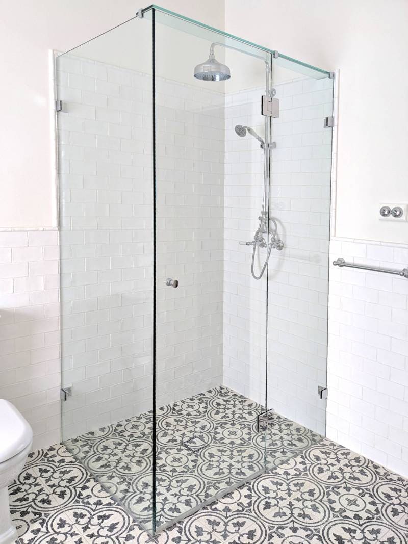 Frameless glass shower screen in a period home bathroom