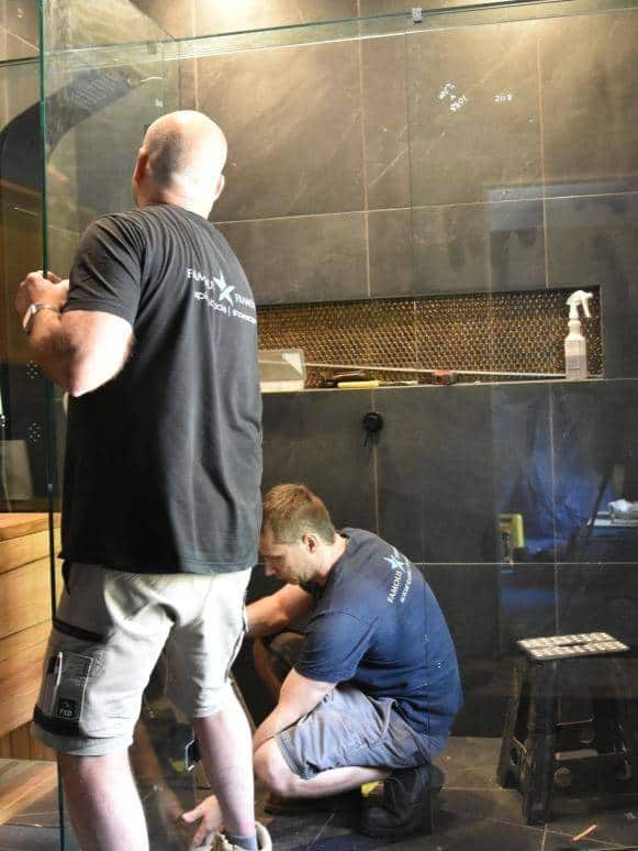 Shower screen installation in progress