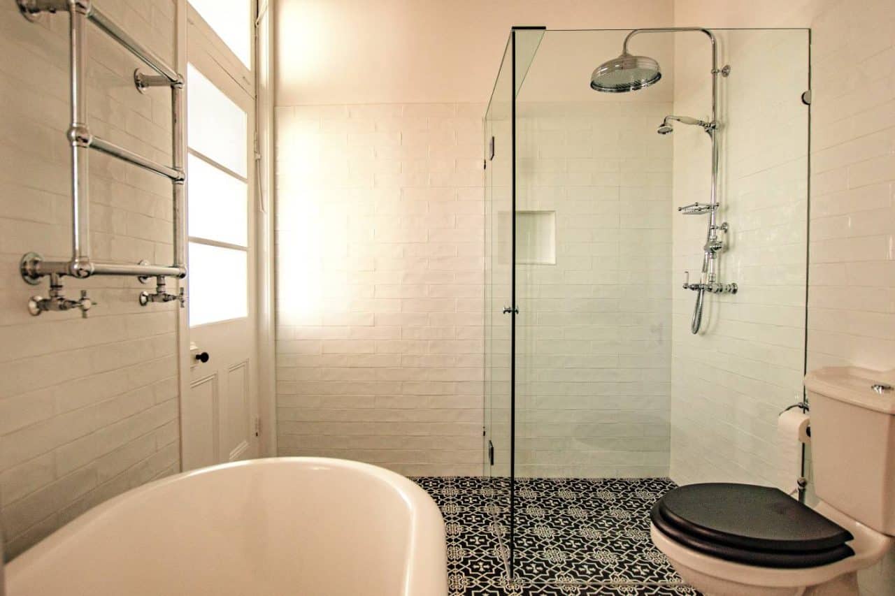 Custom chrome frameless shower screen installed in a Melbourne bathroom