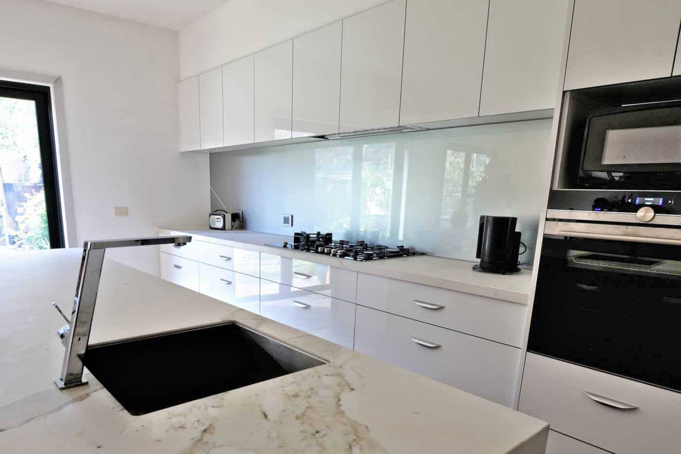 Metallic silver splashback in a Maribyrnong kitchen
