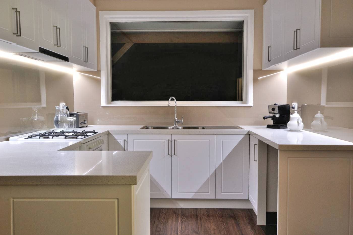 Beige splashback in a white modern Keilor kitchen