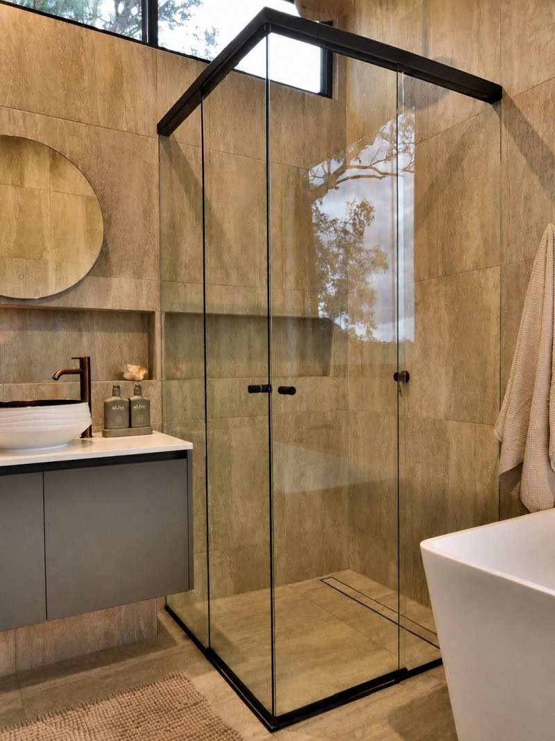 Black corner entry frameless shower screen installed in Eltham