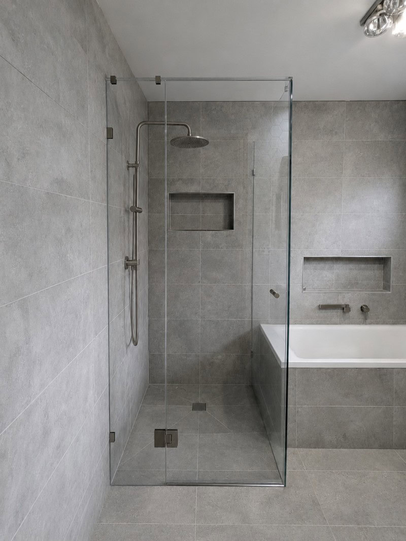 Brushed nickel low iron frameless shower screen installed in a Keilor Downs bathroom renovation