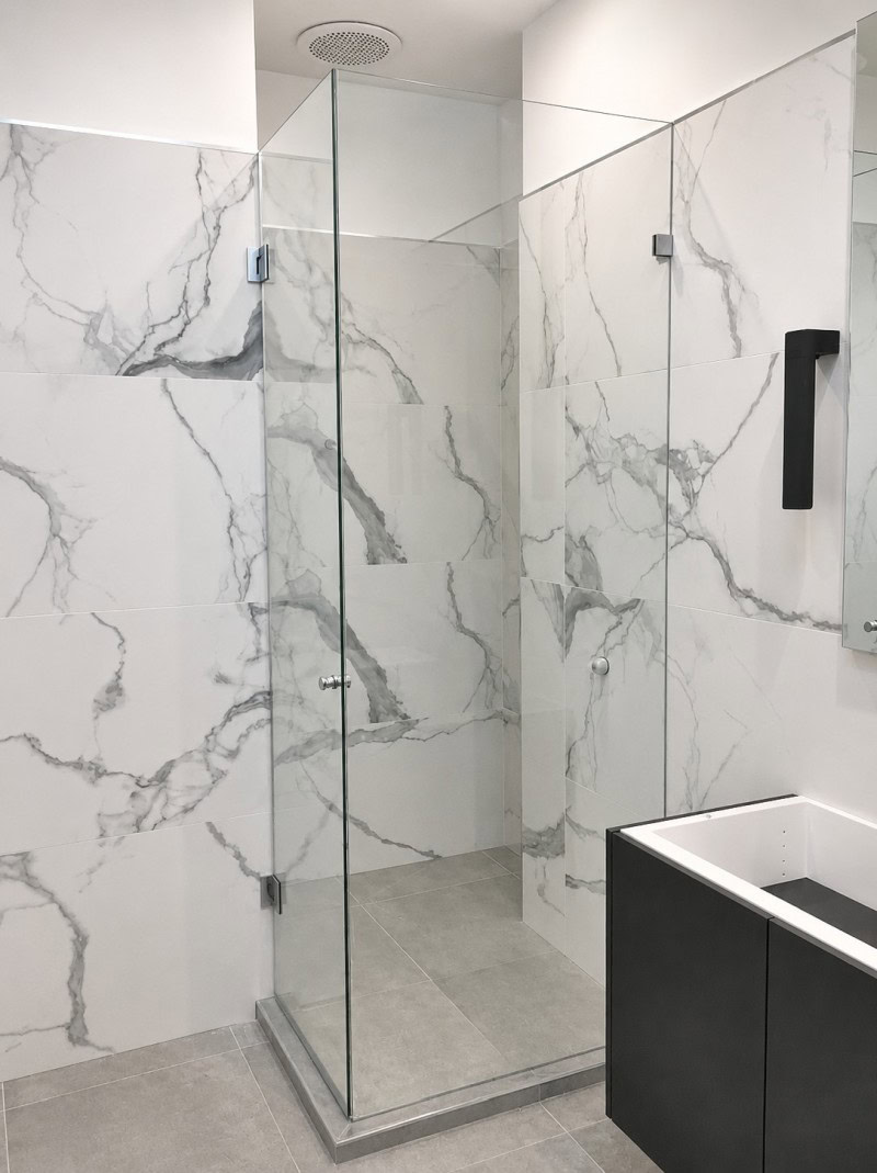 Chrome frameless shower screen installed in Ivanhoe bathroom