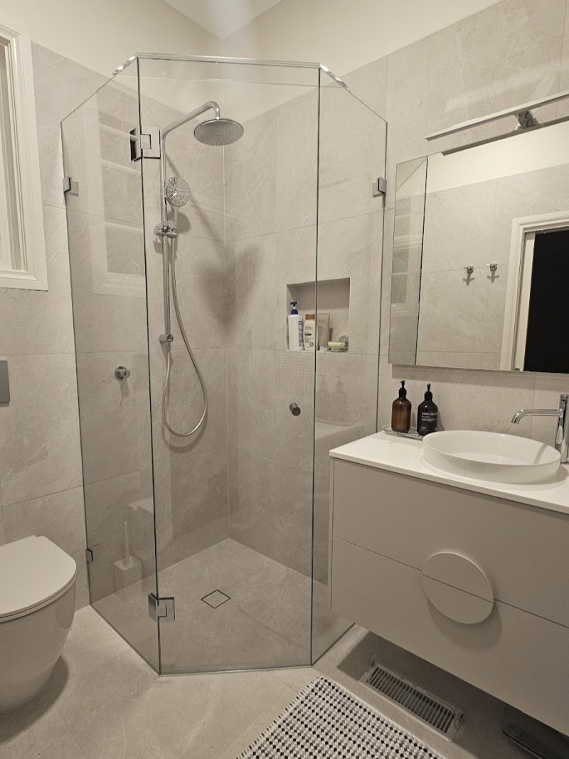 Diamond shape frameless shower screen installed in Essendon bathroom