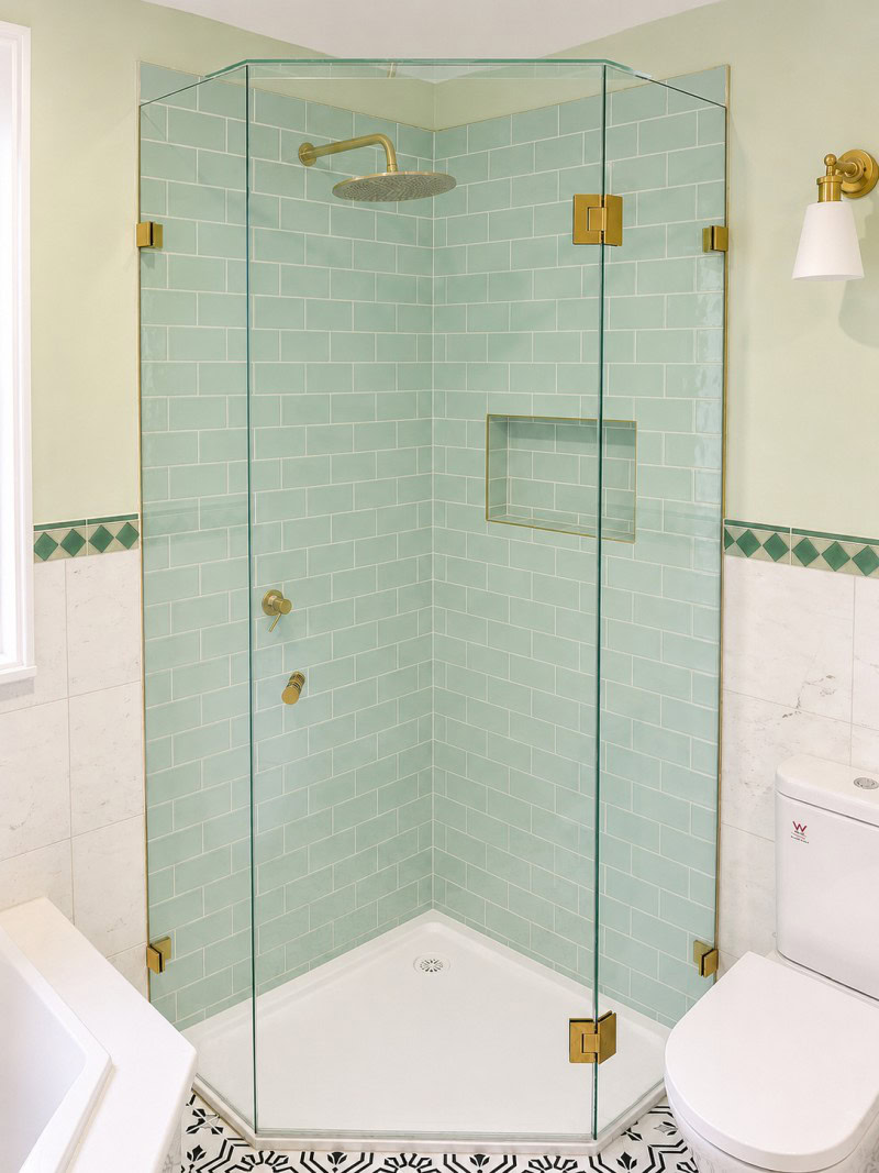 Frameless shower screen installed with subway tiles in Macedon bathroom