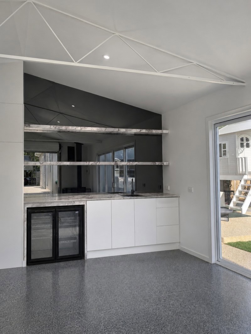 Grey mirror splashback installed in a modern Melbourne kitchen