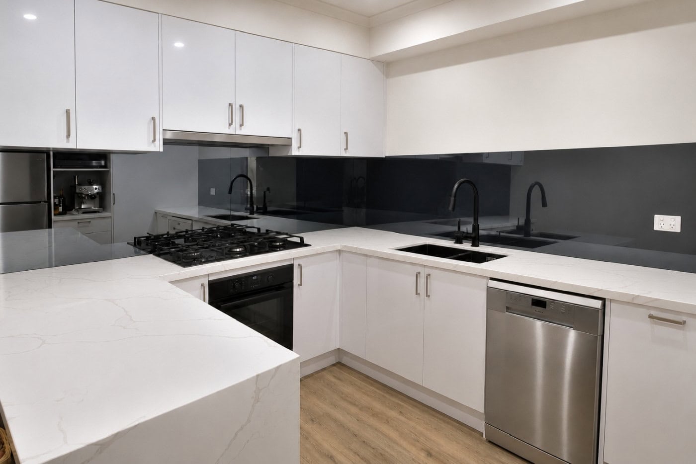Grey mirror splashback in a modern kitchen renovation