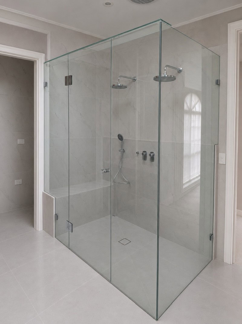 Large frameless shower screen installed in a Keilor East bathroom renovation