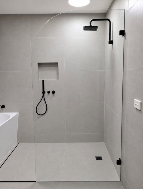 Curved glass shower panel in Melbourne bathroom