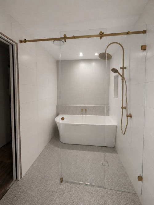 Sliding frameless shower screen in Melbourne bathroom