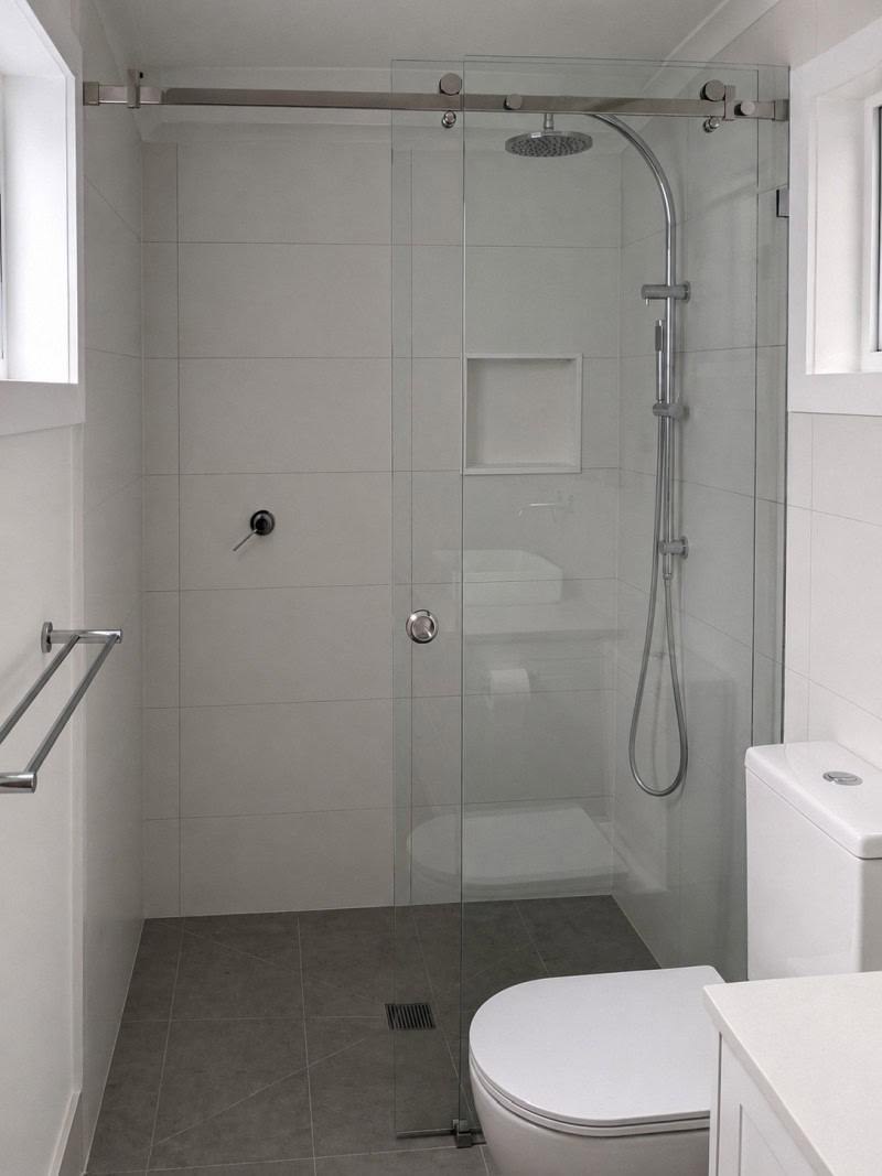 Sliding shower screen installed in Northcote bathroom