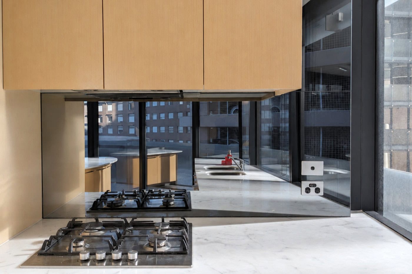 New toughened mirror splashback installed in St Kilda apartment kitchen