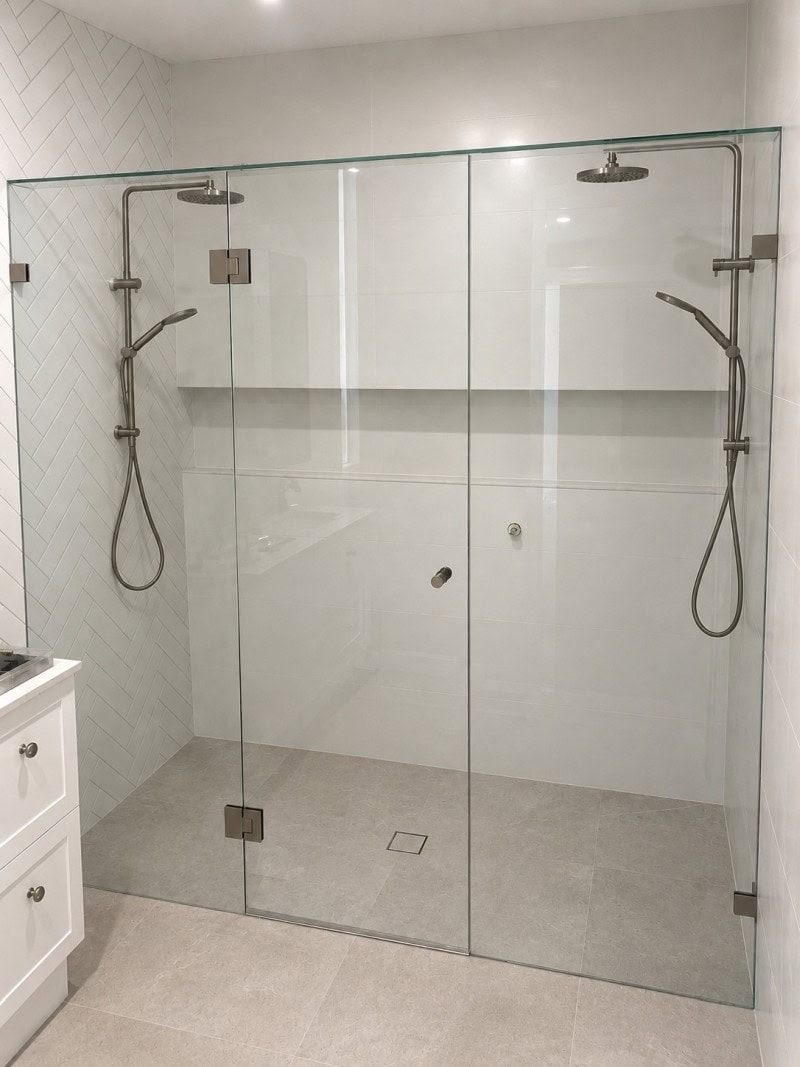 Wall to wall frameless shower screen installed in Hopetoun Park bathroom