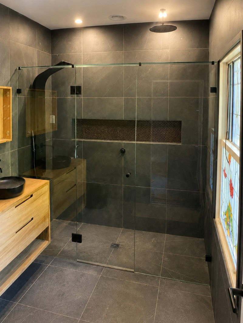 Wall to wall frameless shower screen installed in Macedon bathroom