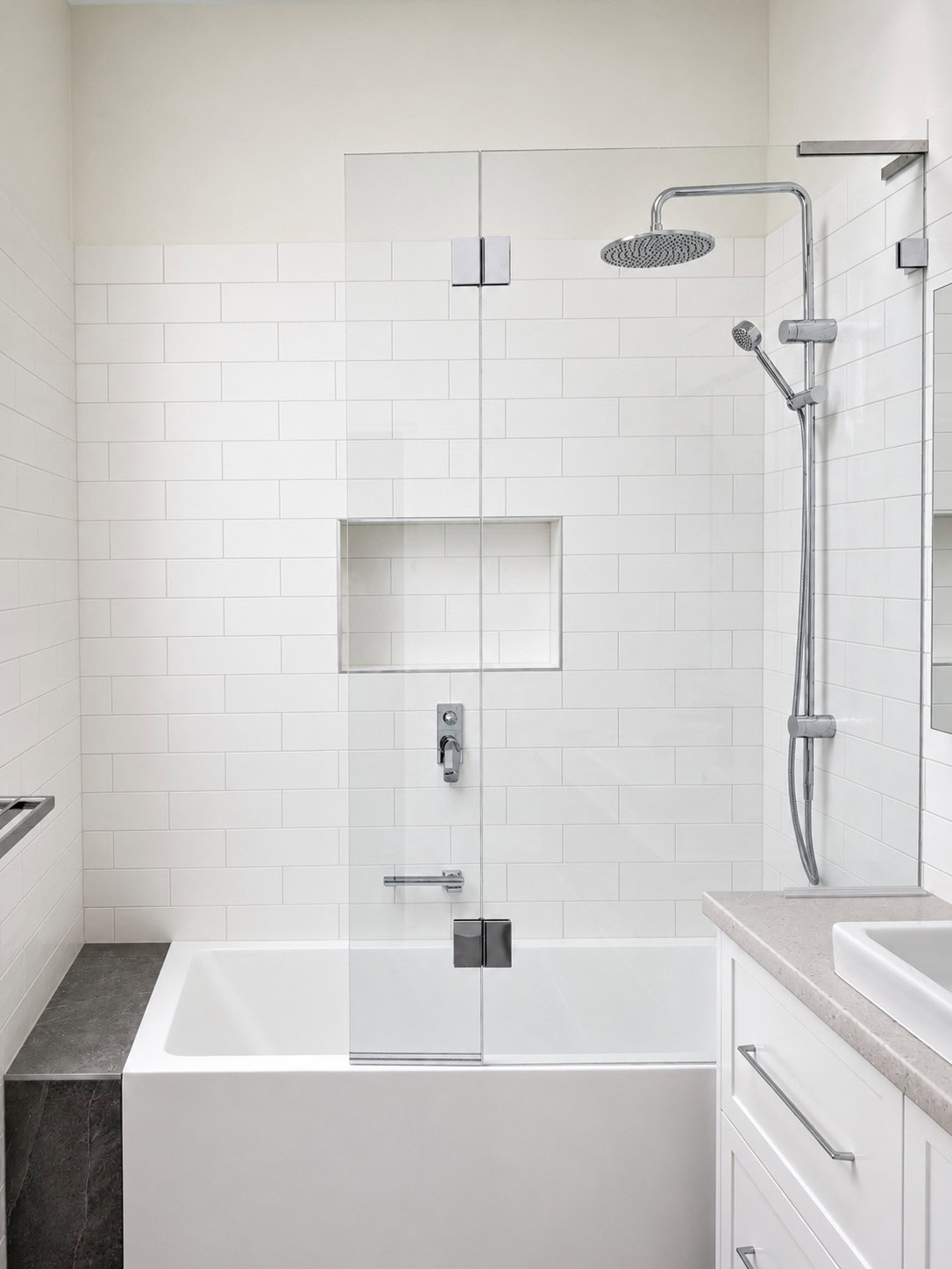 Frameless over bath shower screen installed in a Melbourne bathroom