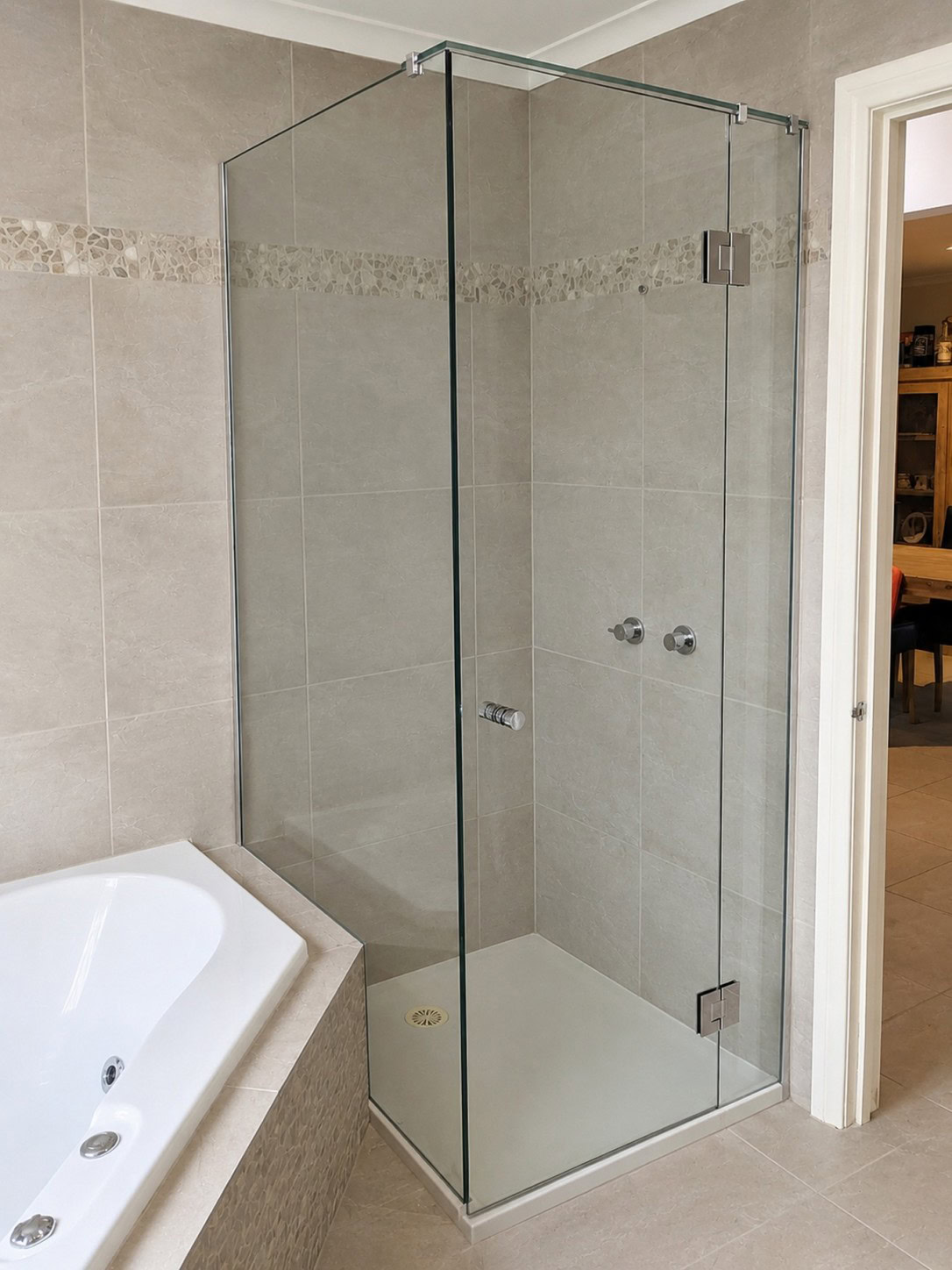 Frameless hinged shower screen installed in Maddingley
