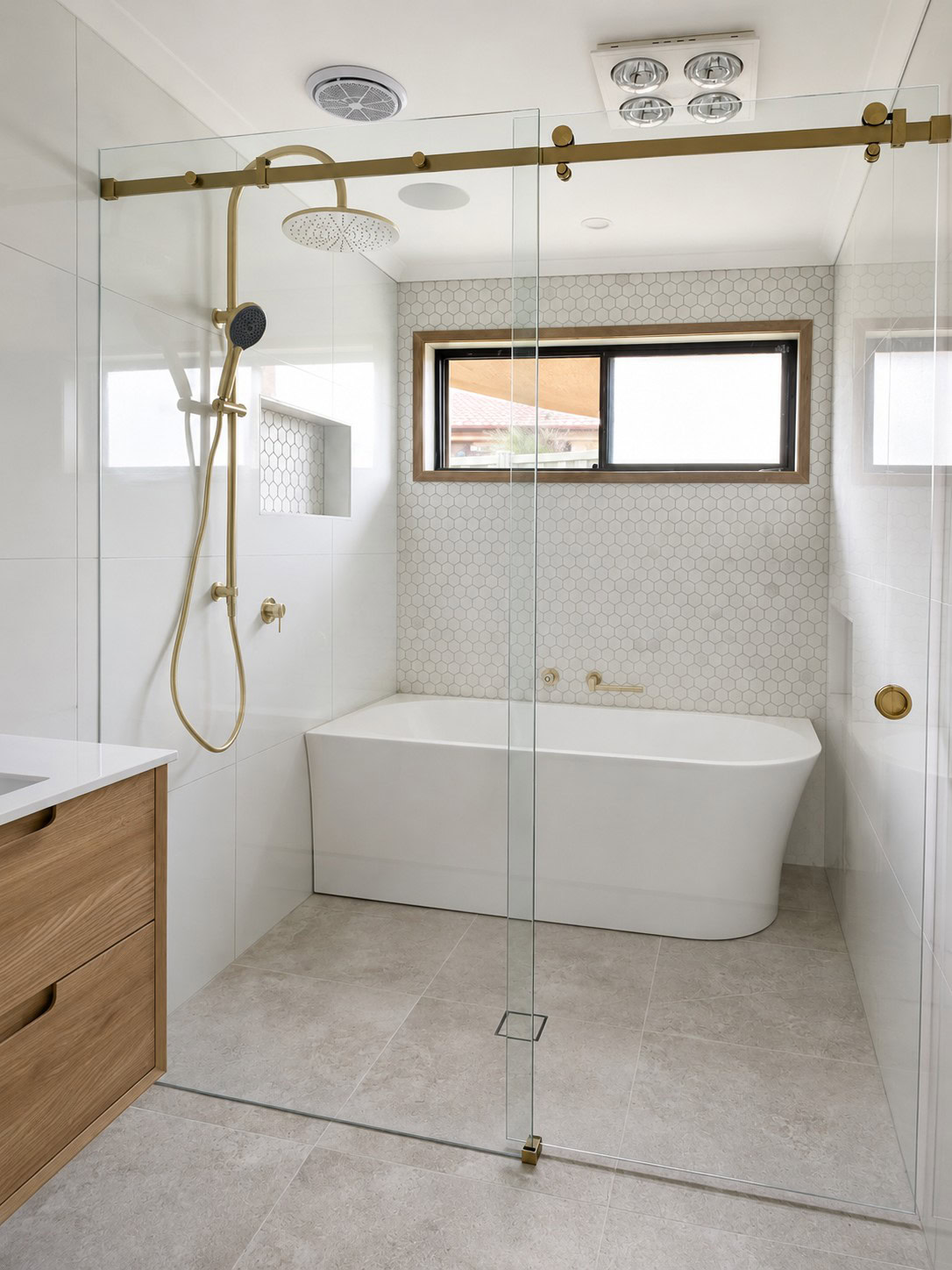 Sliding frameless shower screen in Melbourne bathroom