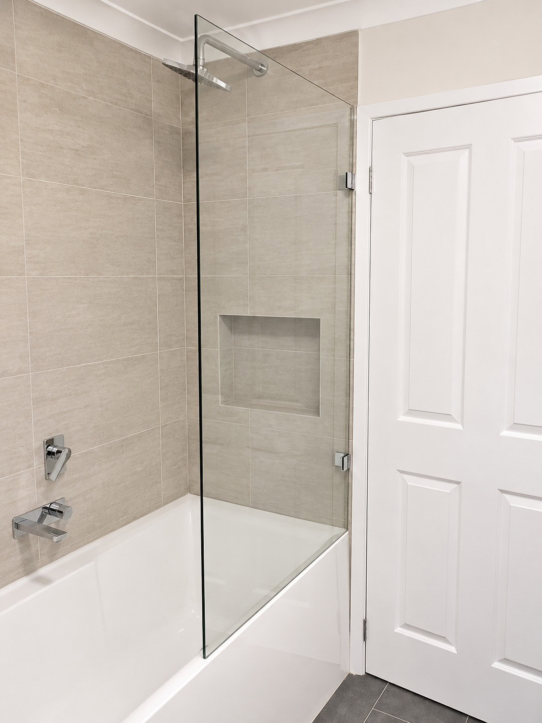 Fixed glass over bath shower screen installed in Footscray bathroom
