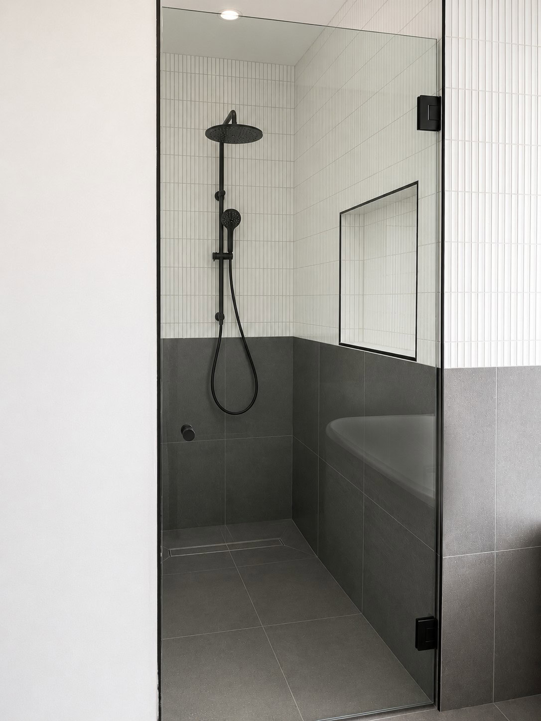 Black clear glass shower screen door installed in Altona bathroom