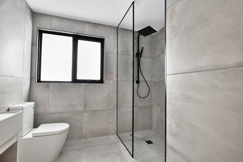 Custom black-frame shower screen installed in a Melbourne bathroom