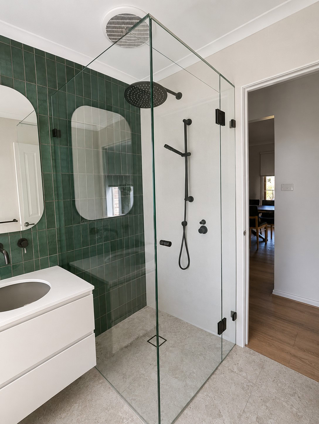 Black frameless shower screen installed in a Darley bathroom renovation