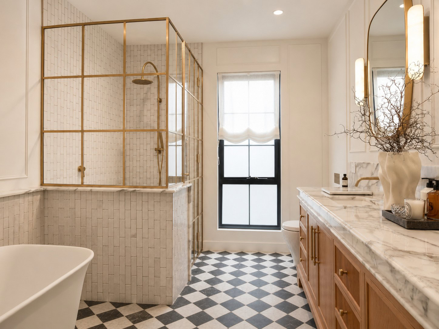 Vertical view of the low iron glass and raw brass shower enclosure
