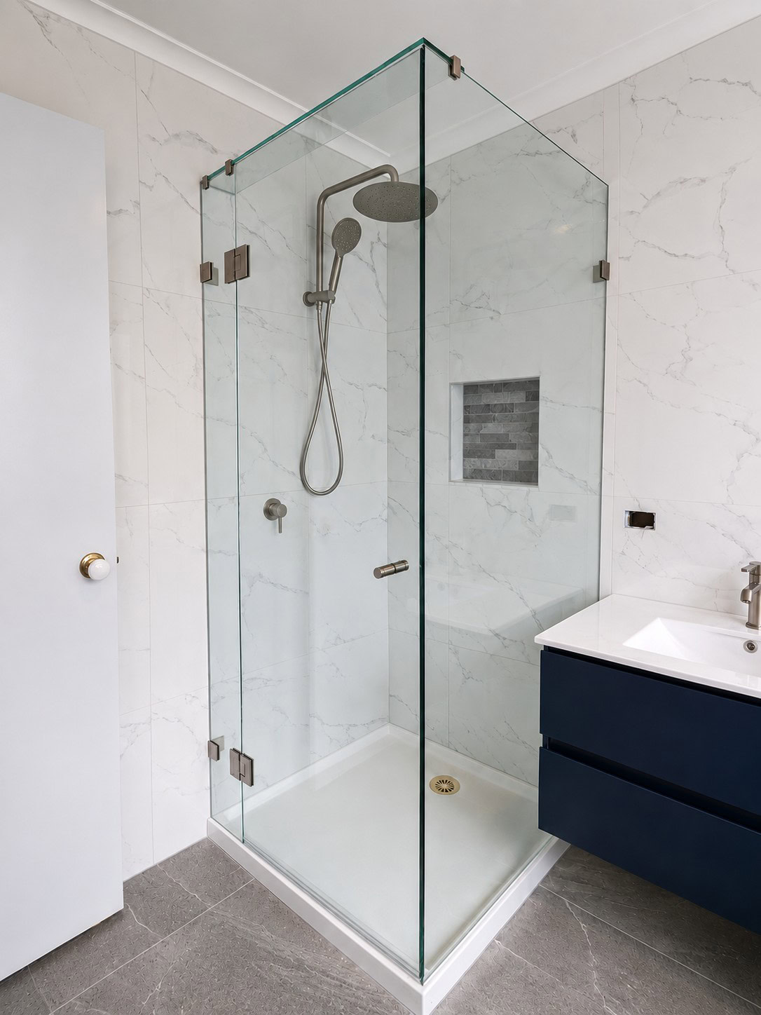 Brushed nickel clear glass shower screen installed in Caroline Springs
