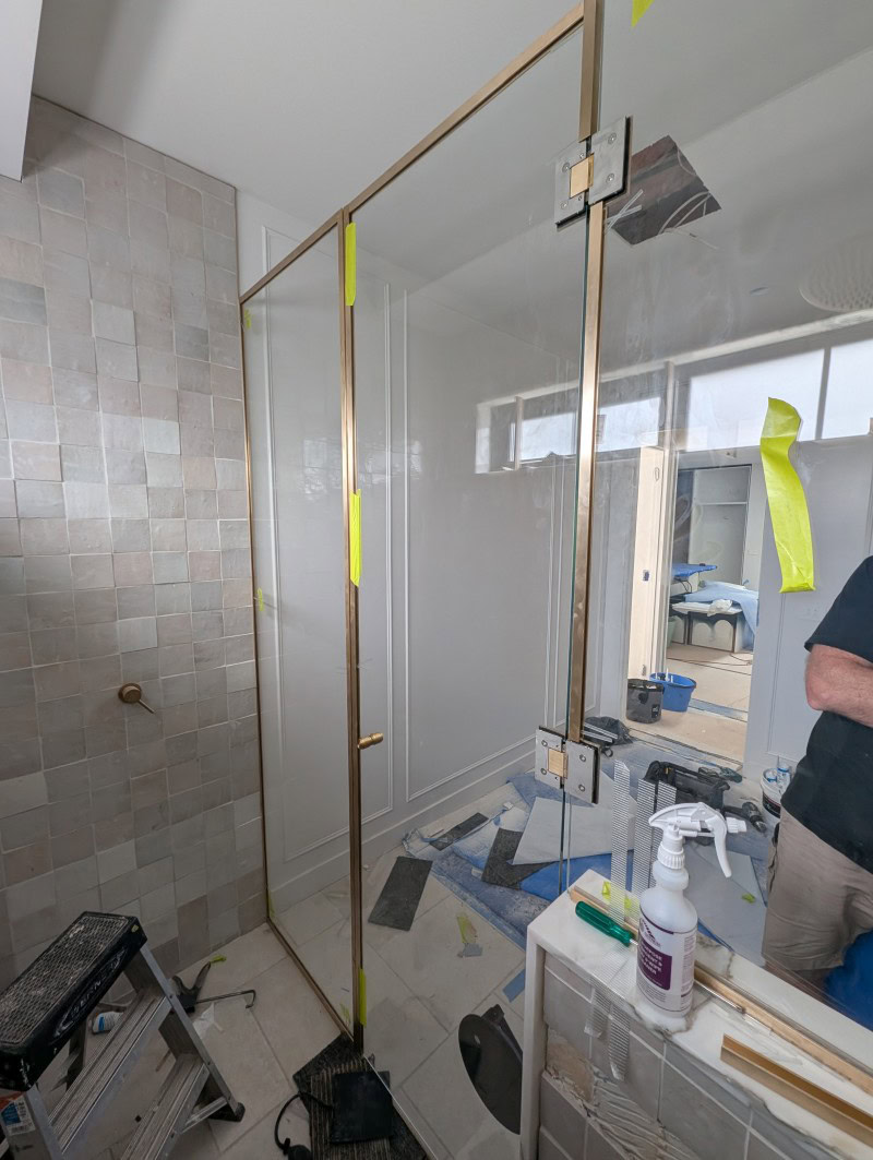Back ensuite low iron glass and heavy duty hinges during installation