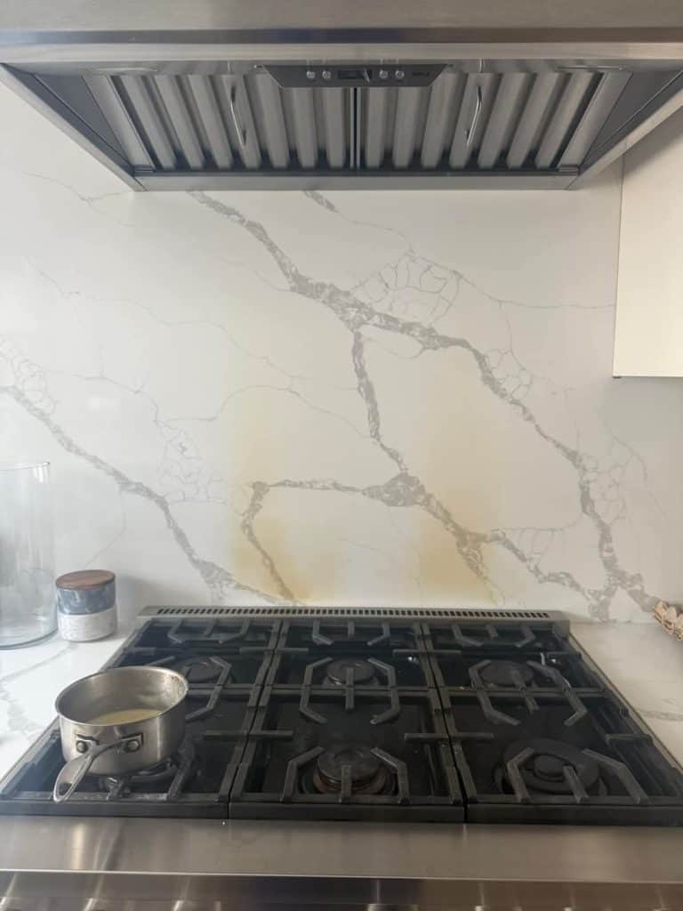 Burnt kitchen splashback ready to be removed and replaced with new glass splashback