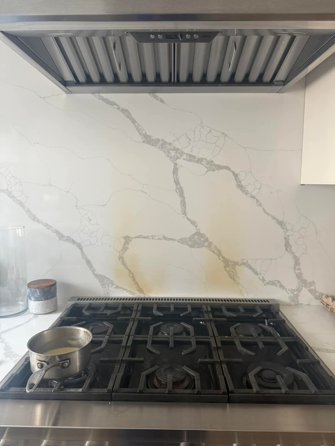 Burnt kitchen splashback ready to be removed and replaced with new glass splashback