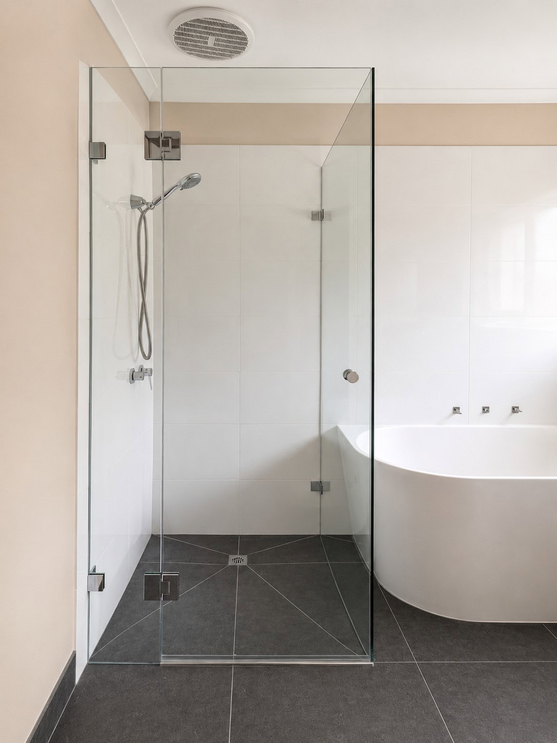 Chrome bathroom frameless shower screen installed in Rockbank