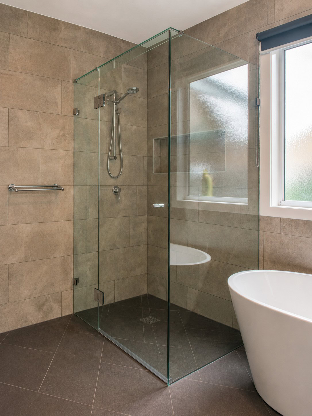 Chrome bathroom frameless shower screen installed in Tarneit