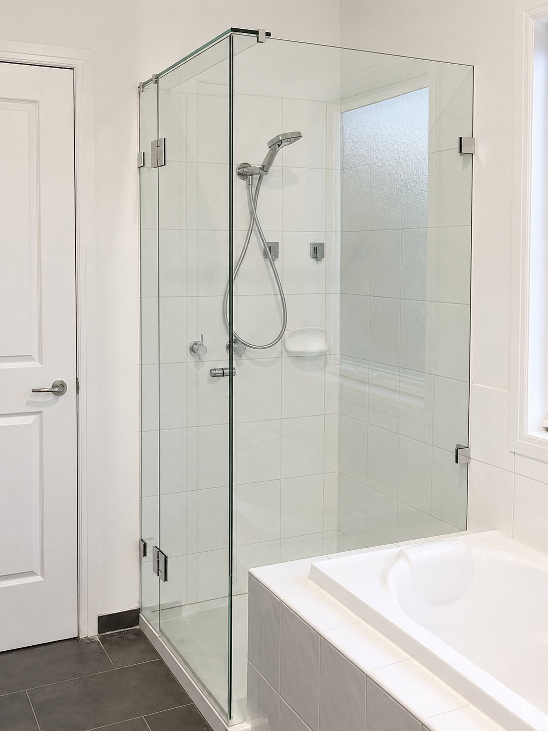 Chrome frameless shower screen after replacement in Templestowe bathroom