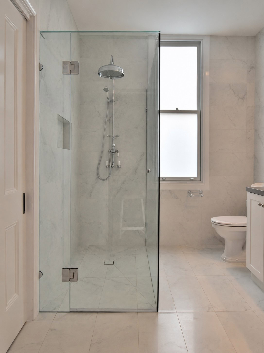 Chrome ensuite shower screen installed in Kyneton bathroom