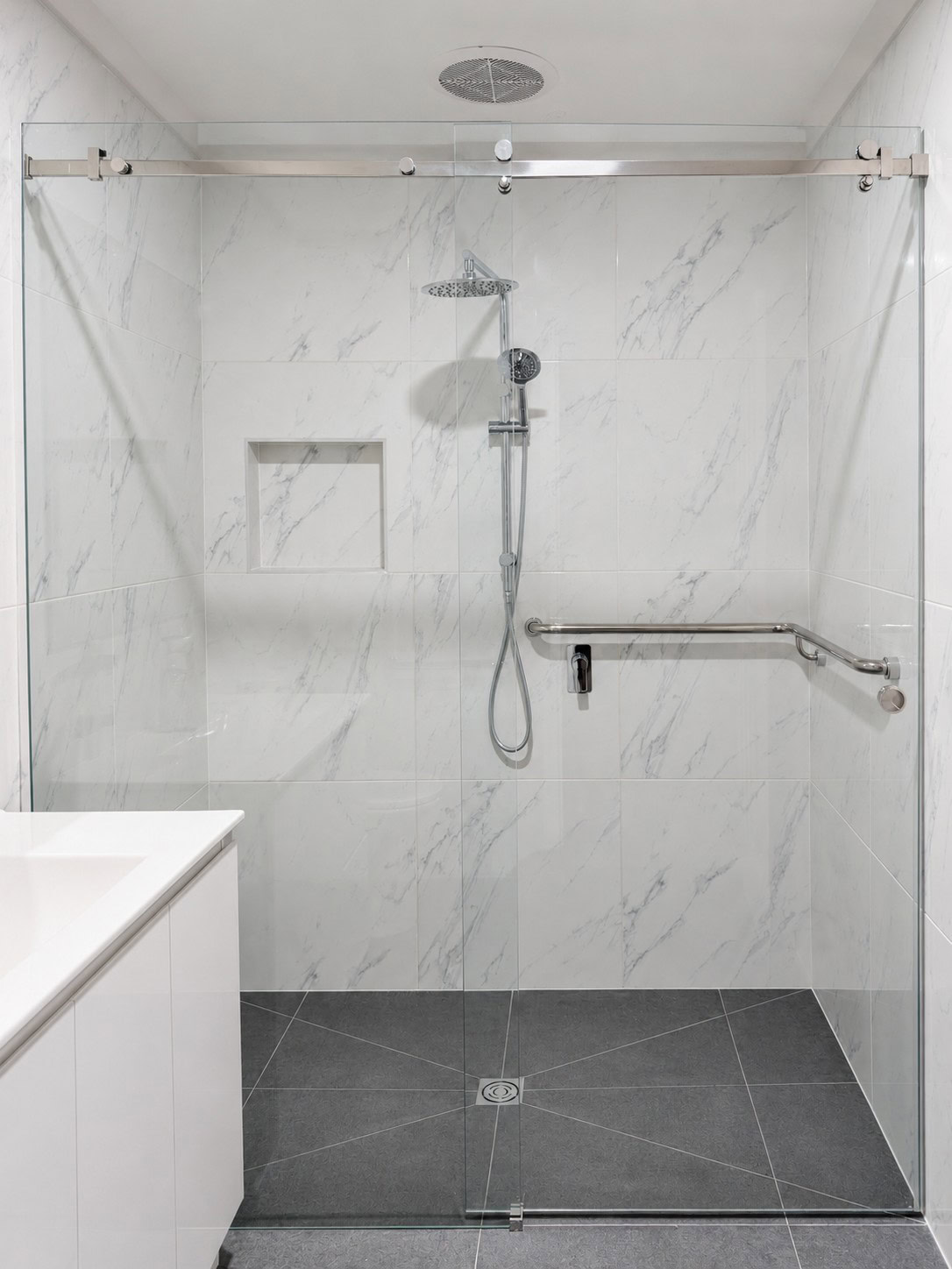 Chrome sliding shower screen installed in Bundoora bathroom