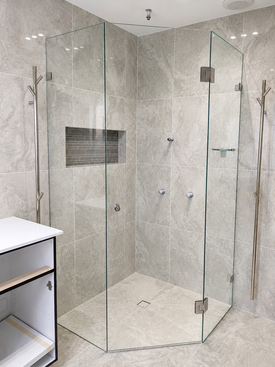 Corner hinged frameless shower screen installed in Melbourne