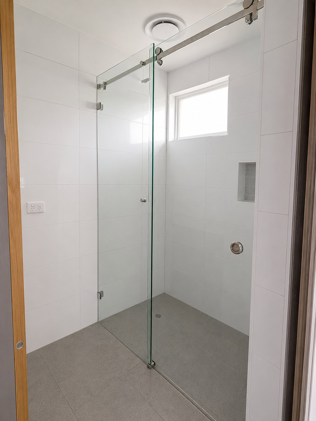 Custom sliding shower screen installed in Bundoora bathroom