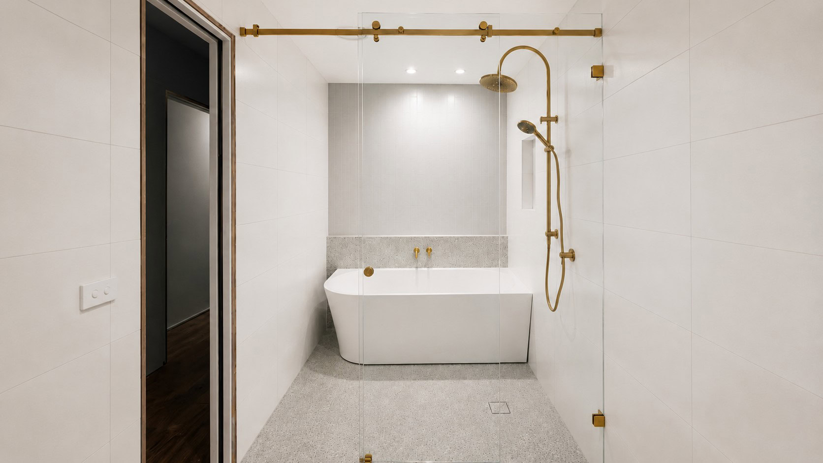 Frameless sliding shower screen installed in a Melbourne bathroom