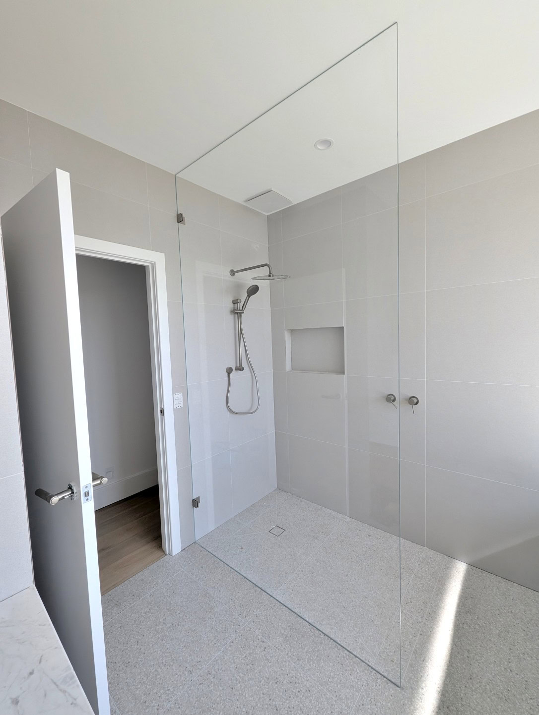 Full height walk-in shower screen installed in Reservoir bathroom