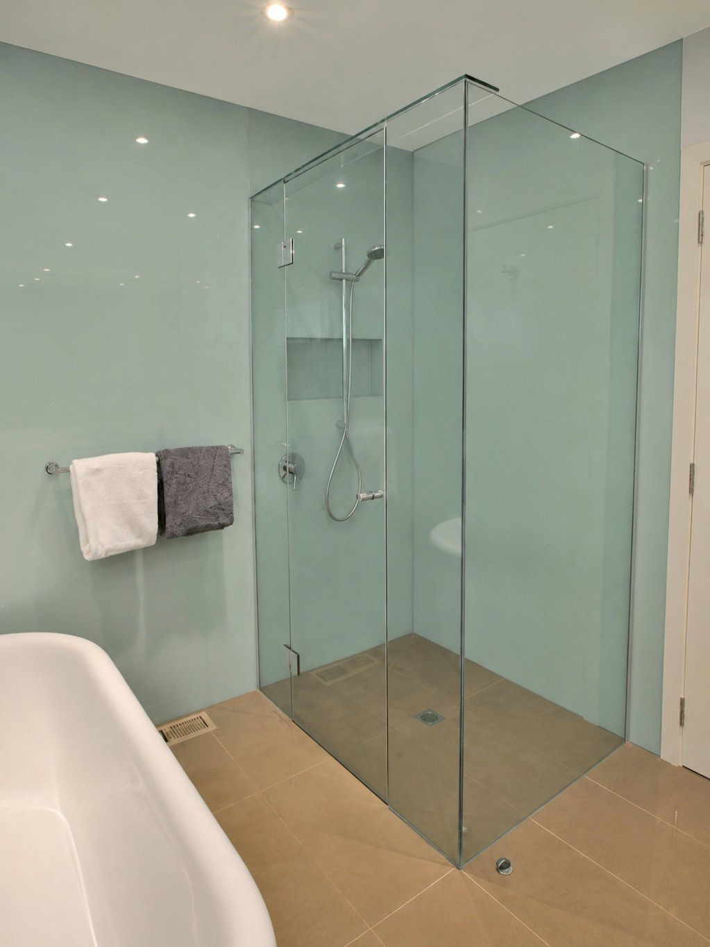 Splashback wall frameless shower screen installed in Montmorency bathroom
