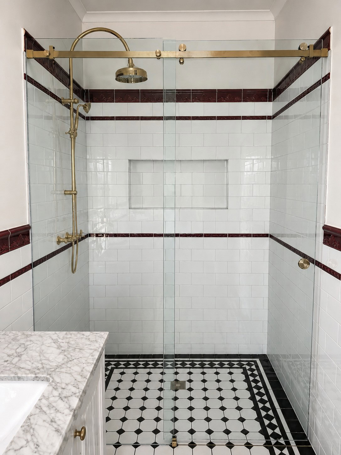 Gold sliding shower screen installed in Bacchus Marsh bathroom