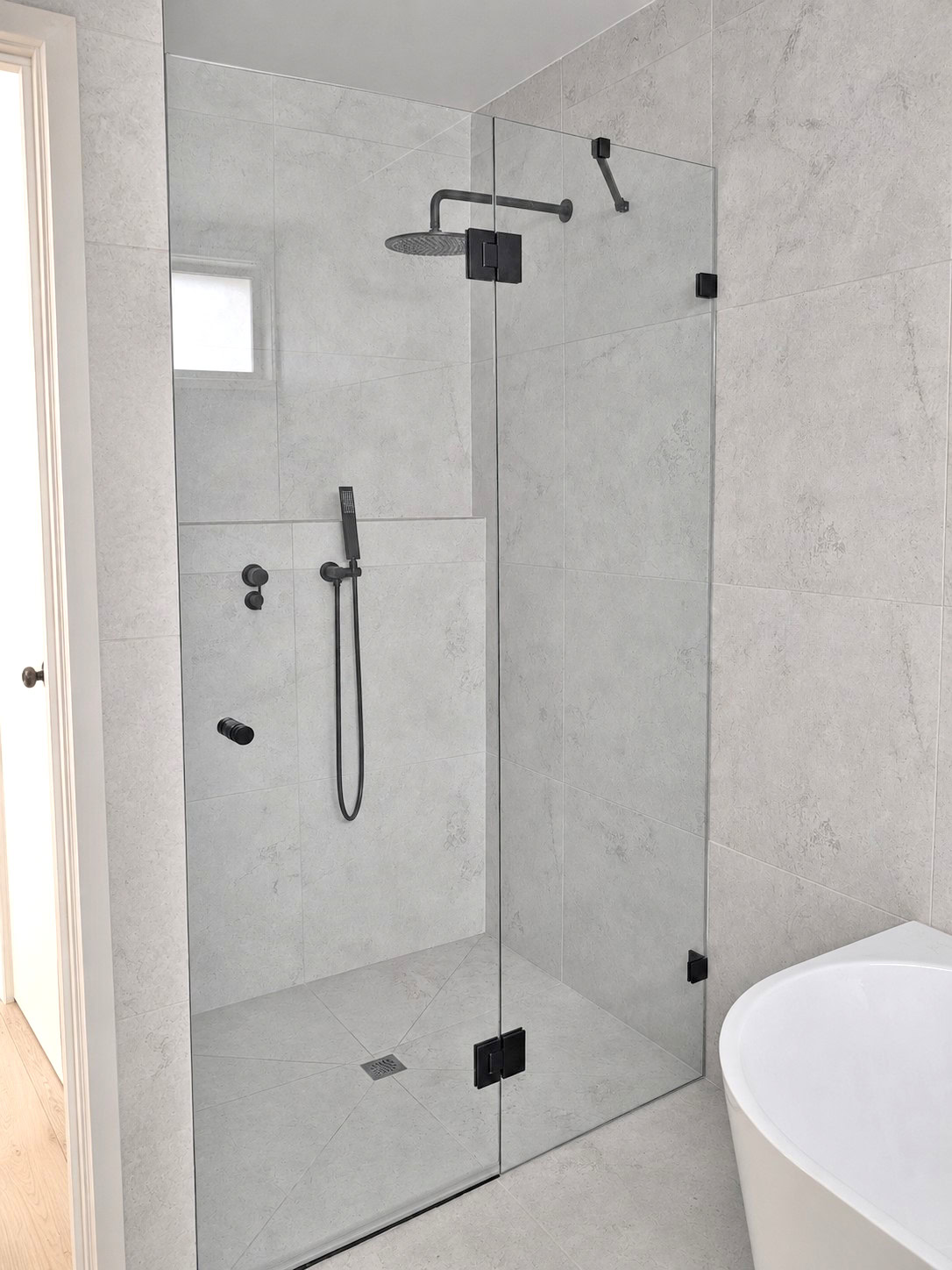 Inline frameless shower screen installed in Keilor Downs bathroom renovation