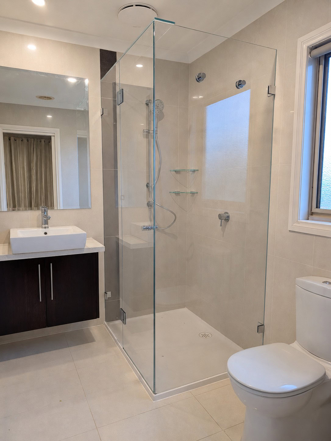 Low iron frameless shower screen after replacement in Sydenham ensuite
