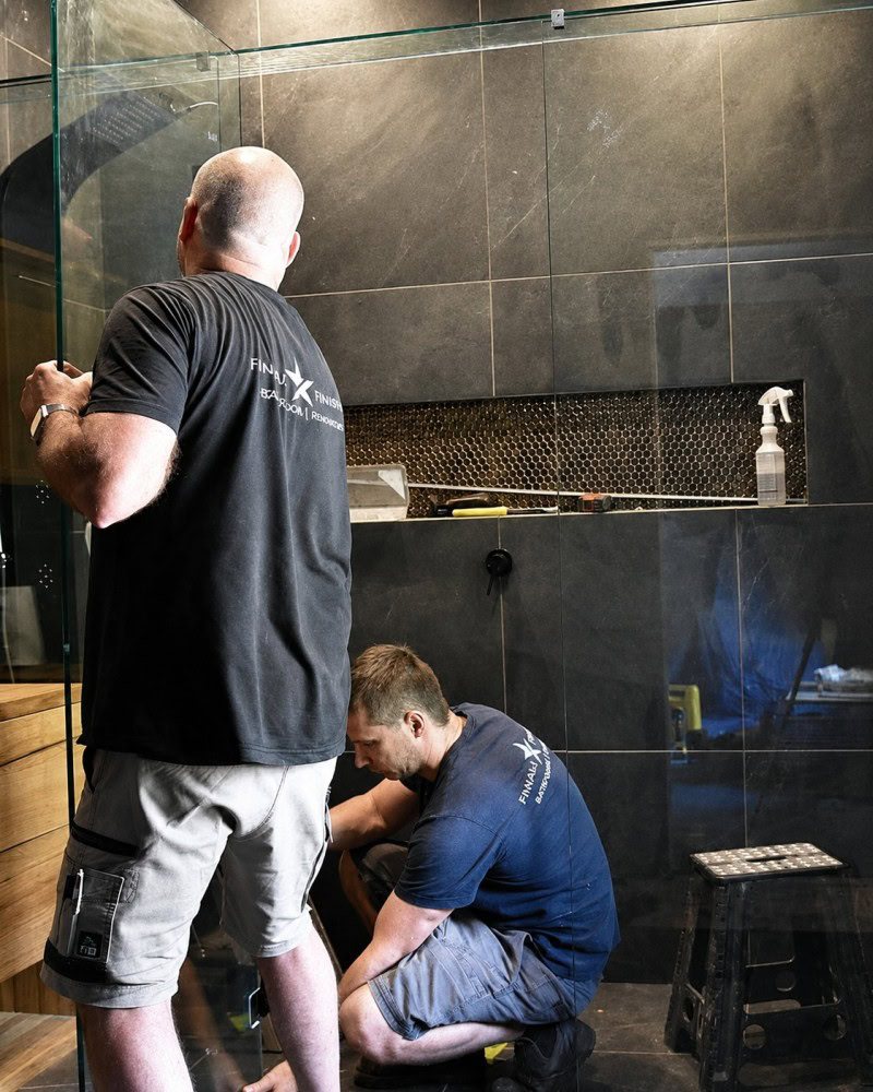 Frameless shower screen installation in progress for a Keilor Downs bathroom