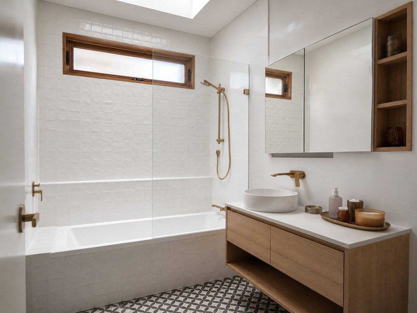Frameless over bath shower screen installed in a Melbourne bathroom