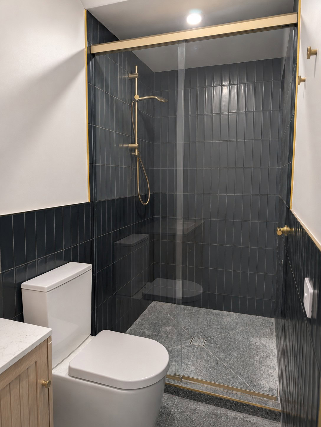 Satin gold 2 panel in line sliding shower screen installed in Preston