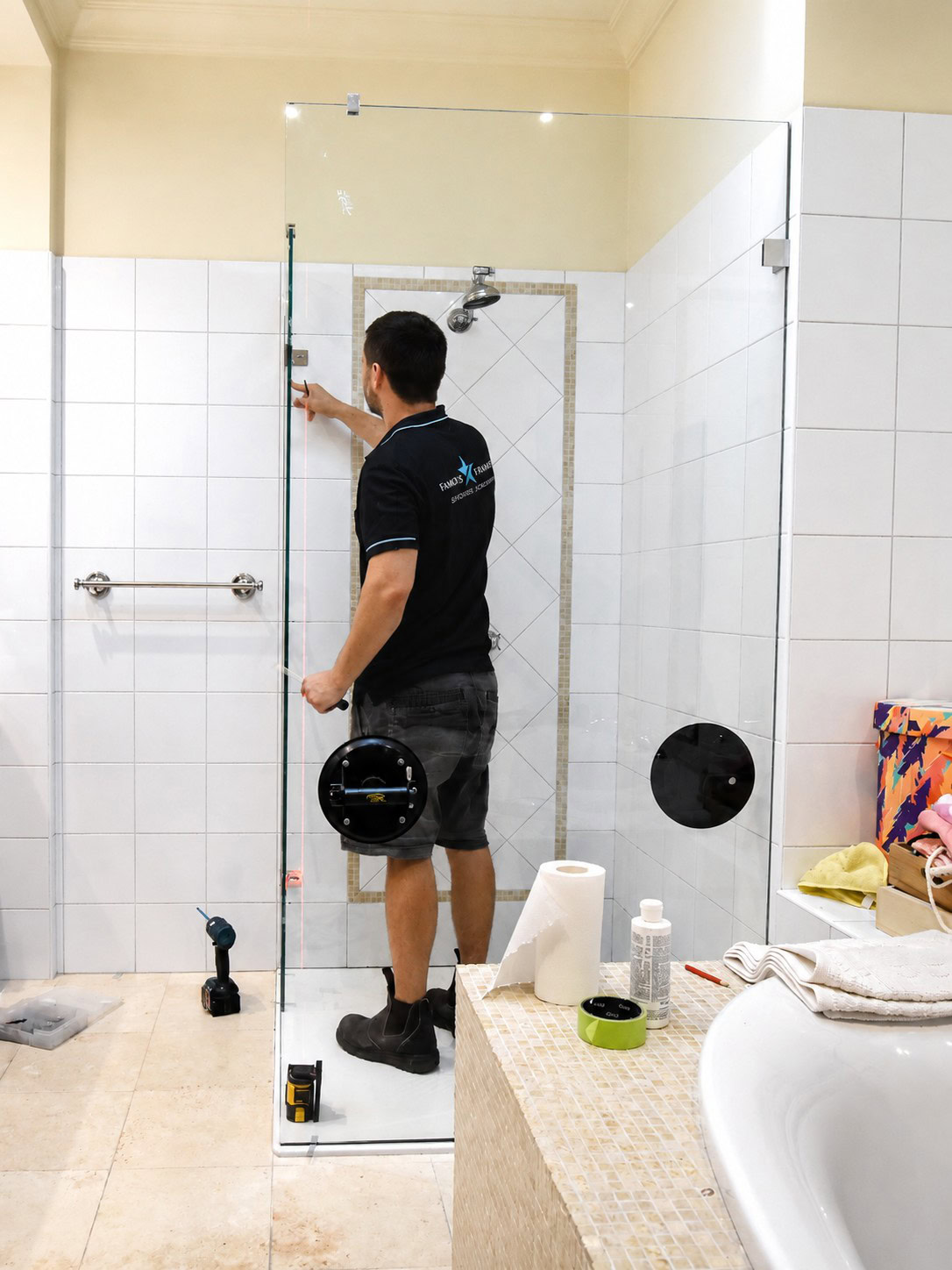 Frameless shower screen installation in progress for an Avondale Heights bathroom